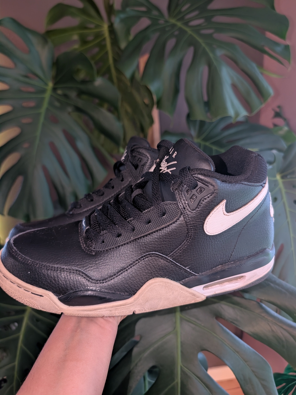 Nike Men’s Black Leather High-Top Sneakers with White Swoosh